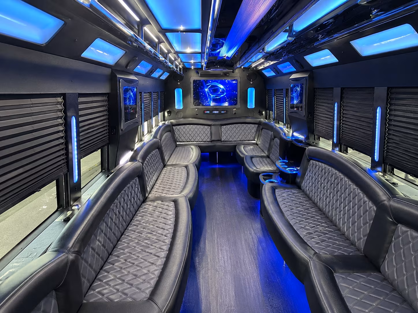Friends laughing during a party bus celebration in Norfolk
